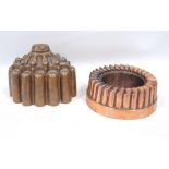 Two Benham & Froud copper jelly moulds, no. 462 and 95, 12cm and 6cm high.