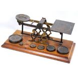 Postal Union Inland Letter Post set of scales with six weights, 31cm long.