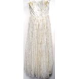 Vintage wedding dress, c. 1940, embellished with flowers, 118cm long.