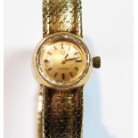 Lady's Omega 9ct gold watch on Milanese bracelet, 1964, with box and papers.