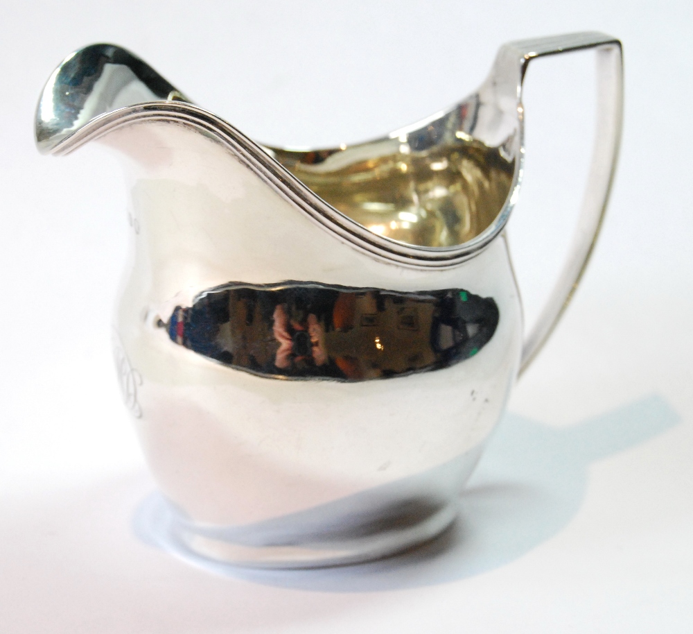 Silver plain oval cream jug with reeded border and handle, by William Hall, 1805.