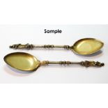 Set of twelve silver gilt ice spoons with figure terminals by Wm Eley, 1873, 7½oz.