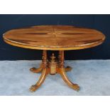 Victorian oval marquetry walnut looe table on column supports and downswept legs with brass castors,