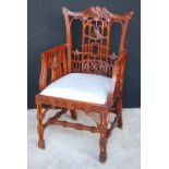 Reproduction Chinese Chippendale style elbow chair with drop-in seat and cluster column legs,