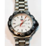 Gent's Tag Heuer Formula 1 quartz watch, stainless steel, on bracelet, with case and box.