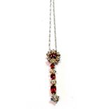 Ruby and diamond pendant with single ruby and six diamond cluster,