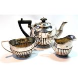 Silver individual three-piece tea set of part fluted oval shape, Birmingham 1901, 10oz.