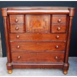 Victorian mahogany chest with a concealed frieze drawer above five small and three long drawers,