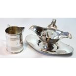 Silver double-hipped sauce boat with beaded edge and handles, upon stand, Birmingham c.