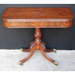 Victorian mahogany D-shaped pedestal tea table on brass-capped sabre legs and brass castors,