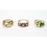 Three-stone amethyst ring and two others, citrine with blue diopside and citrine and peridot,