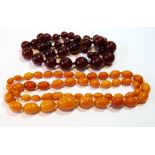 Necklet of graduated oval amber beads and another.