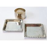 Pair of silver square ashtrays, 1888, and a napkin ring.