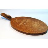 Robert 'Mouseman' Thompson carved oak cheese board, 37cm long.