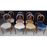 Eight Victorian walnut dining chairs.