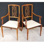 Pair of Edwardian line inlaid mahogany elbow chairs, 94cm high.