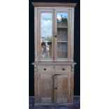 Victorian pitch pine bookcase with glazed top above two cupboards, 216cm high and 88cm wide.