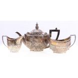 Victorian silver three piece teaset with half gadrooned body, Sheffield 1884,