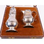 Cased silver sugar sifter and castor, makers Sorley of Glasgow, each of ribbed baluster form,
