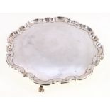 Silver tray, of serpentine circular form, raised on scroll feet, maker HA, Sheffield 1932, 627g,