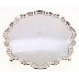 Silver tray, of serpentine circular form, raised on scroll feet, maker HA Sheffield 1930, 828g,