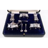 Cased silver five piece cruet set of oval from, Birmingham 1915, 166g gross.