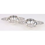 Pair of lobed silver quaichs, maker SB with pierced lug handles. London 1910, 250g gross.