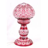Ruby flash cut glass table lamp with globular shade,