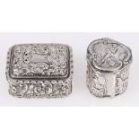 19th century Dutch silver pill box, 3.5cm and a Victorian silver embossed pill box, 5cm, 43g gross.