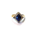 Ring of lozenge shape with lapis lazuli, cabochon diamonds and, probably, tanzanite, in gold, '375'.