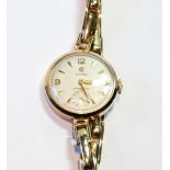 Cyma lady's 9ct gold watch, probably 1958, on expanding bracelet.