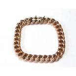 Gold hollow curb bracelet, patent snap, by H. Grinsell & Sons, '9ct'.