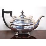 Silver teapot of rectangular boat shape on bun feet, Walker & hall, Sheffield 1910, 22oz.