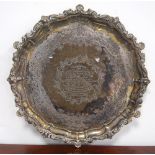 Silver circular tray with shaped, moulded and foliate border, inscribed, by Harry Atkin,