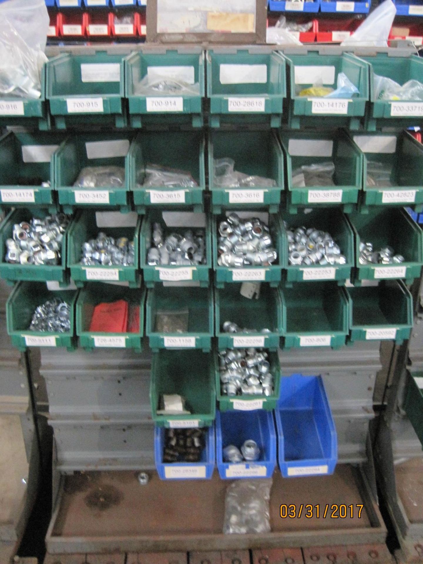 Bin rack with bins of conduit strain reliefs 22x36x50
