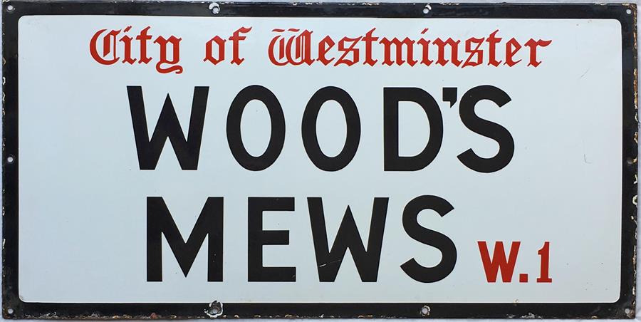A City of Westminster enamel STREET SIGN from Wood's Mews, W1, a short thoroughfare off Park Lane in