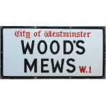 A City of Westminster enamel STREET SIGN from Wood's Mews, W1, a short thoroughfare off Park Lane in