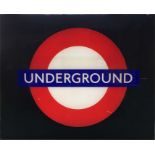 A London Underground STATION ROUNDEL SIGN 'UNDERGROUND'. Made of perspex and designed to be back-