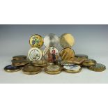 A collection of twenty four brass powder compacts,