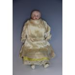 A French bisque fashion doll, painted bisque head, arms and feet, with jointed white cloth body,