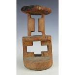 A carved wood tribal stool, possibly Zimbabwe Tonga, with two geometric sections,