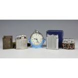 A Smiths pocket watch stand in pale blue containing a Smiths open face pocket watch,