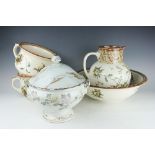 A Royal Doulton Pomegranate pattern four piece wash set, decorated in an Aesthetic manner,