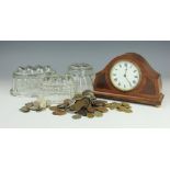 An Edwardian inlaid mantle clock, of arched form and on four bun feet, 14.