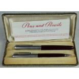 A Parker 51 fountain pen and propelling pencil, in burgundy and steel,