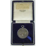A silver shooting medal dated 1952,