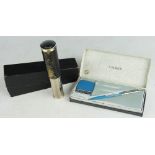 A Parker ball point pen, with shillings to new pence converter, in original box with tape measure,