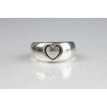 A George Jensen silver ring, with cut-out heart design, numbered 320, impressed marks, weight 5.