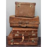 A vintage tan leather suitcase, stamped 'Suela Garanua', 69cm,