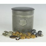 A pewter cigar case and cover, the cylindrical case baring coat of arms, 12cm high,